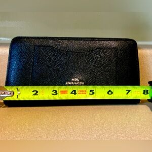 Coach black tri fold wallet.